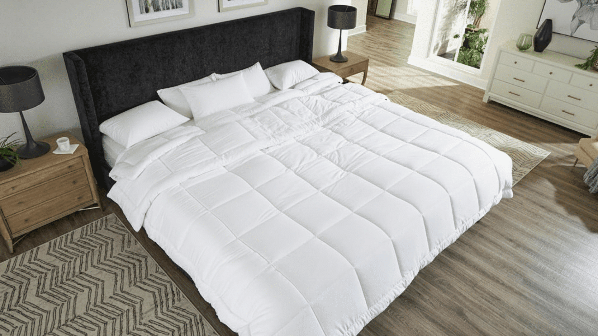 Alaskan bed with white bedding, demonstrating extra sleeping space in a bright bedroom