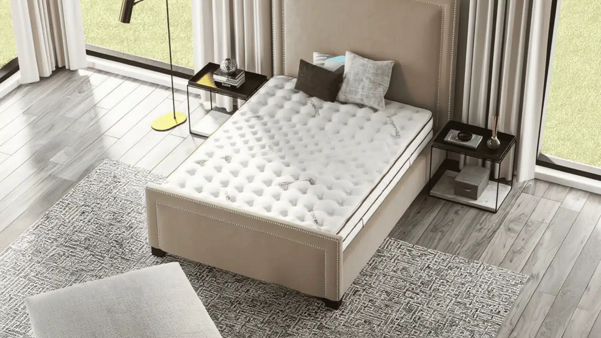 Saatva Classic mattress on a beige bed frame with pillows