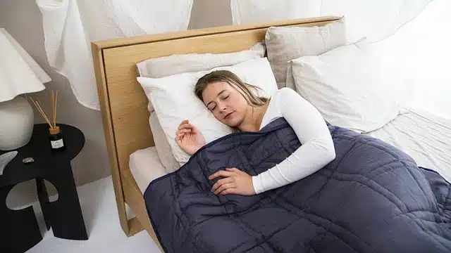 women sleeping in blanket