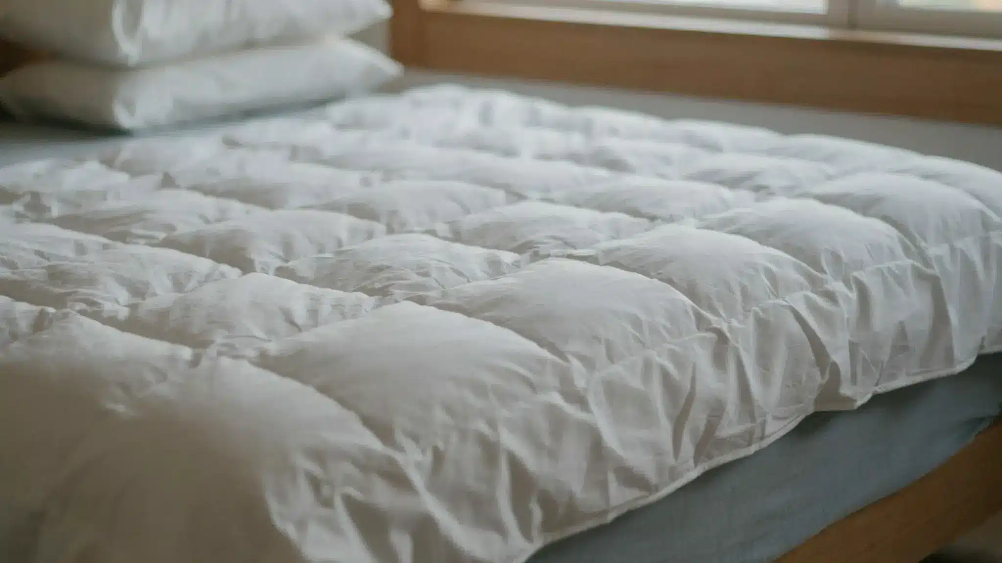 White quilted duvet insert showing stitching and fluffy texture